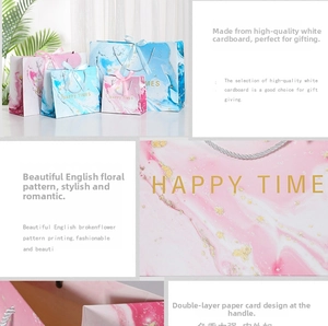 Detailed collage of marble pattern gift bags with gold lettering and silk ribbon handles