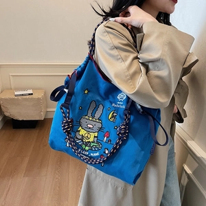 Large blue canvas tote bag with cartoon rabbit embroidery and woven rope handles