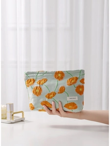 Floral canvas makeup bag with orange poppy patterns and green fabric for women