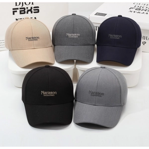 Detail view of Narason FASHIONES baseball caps in five neutral colors on display