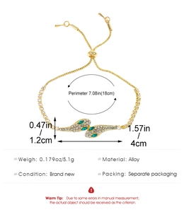 Detail of adjustable gold snake bracelet with zircon inlay and product measurements