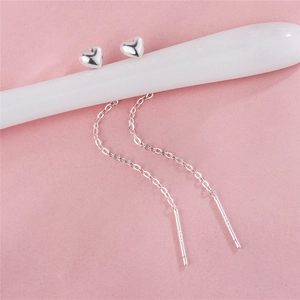 Elegant S925 sterling silver heart-shaped tassel ear threaders on ceramic display stand