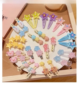 Flat lay display of colorful Y2K star and cloud hair clips in pastel macaron shades