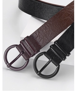 Close-up of black and dark brown PU leather belts with round metal pin buckles