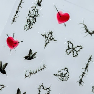 Gothic butterfly and thorn heart nail art stickers in black and red aesthetic design
