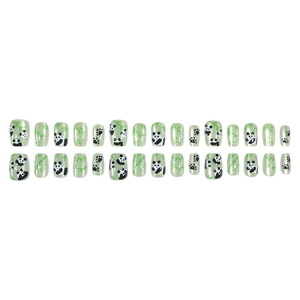 Short cat-eye press-on nails with panda and bamboo designs in light green glitter finish
