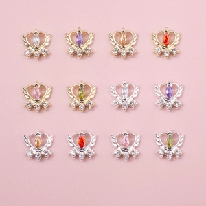 Detail of 12-piece heart wing nail charms with marquise colorful zircon stones