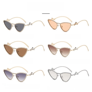 Detailed grid of cat-eye sunglasses with pearl edges and metal butterfly accents in six colors