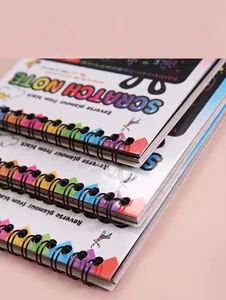 Detail view of colorful DIY scratch note book with black metal spiral binding and cover