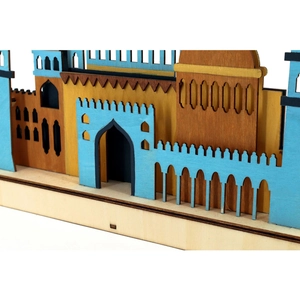 Detail of laser-cut colorful wooden moon lamp with middle eastern architectural patterns