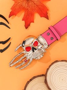 Detail of punk pink leather belt with silver skull buckle on decorative orange background