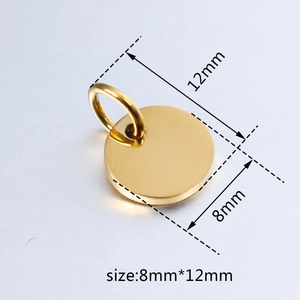 Macro detail of 8mm by 12mm golden stainless steel round pendant with size markings