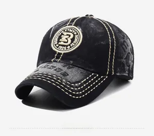 Detail of washed black vintage baseball cap with contrast stitching and 'B' badge