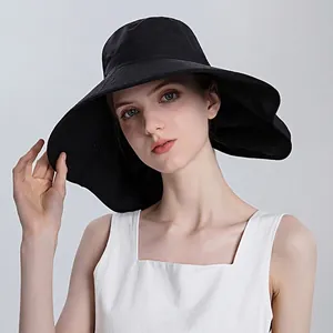 Stylish black wide-brim sun hat for women providing full UV protection for outdoor use