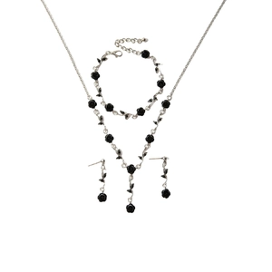 Detailed set of black rose necklace, bracelet and earrings on silver chain