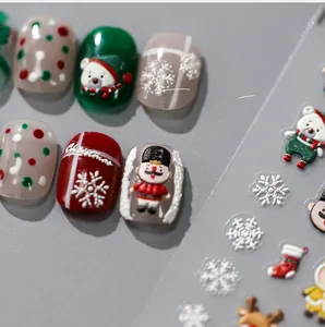 Macro detail of 3D embossed Christmas nail stickers with Nutcracker and bear designs