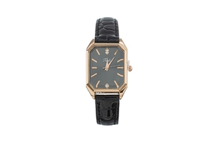 Detail of rose gold octagonal watch case with crystal markers and black leather strap