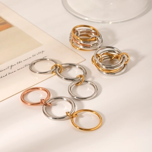 Polished stainless steel interlocking ring set in silver, gold and rose gold finishes