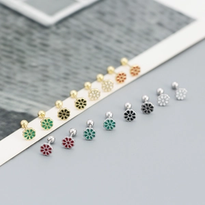 Detailed arrangement of colorful floral 925 silver stud earrings in various enamel finishes