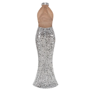 Detail of silver sequin fishtail dress with backless halter design and sheer mesh paneling