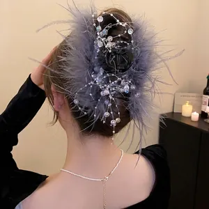 Elegant hair claw clip with grey feathers and colorful glass beads for a sophisticated look