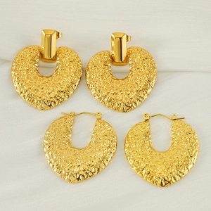 18K gold-plated irregular heart earrings with hammered texture on white silk background