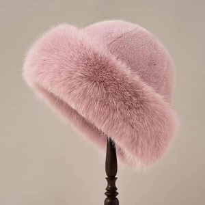 Detailed close-up of fluffy pink faux fur hat texture on a vintage wooden stand