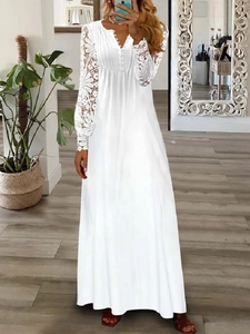 Elegant white V-neck maxi dress with long lace sleeves for a stylish evening look