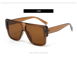 Detail view of large square tea-colored sunglasses with C06 product code on white background