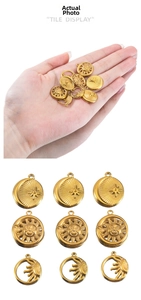 Detailed view of vintage gold stainless steel sun and moon charms for DIY jewelry making