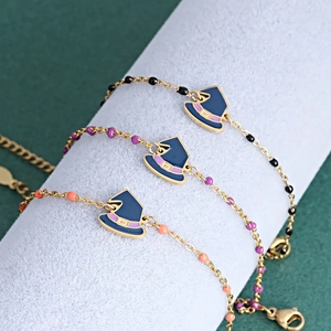 Halloween charm bracelet with dark blue wizard hat and colorful beads on gold chain