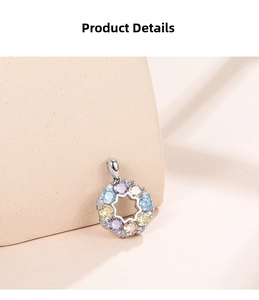 Detailed close-up of 925 silver necklace with rainbow gemstone floral wreath pendant