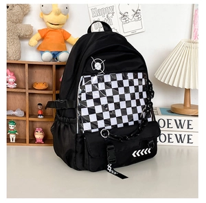 Detail of black preppy backpack with checkerboard pocket and decorative thick chain