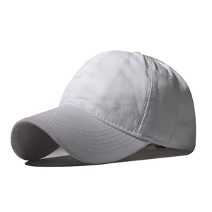 Side view of a plain white cotton baseball cap showing 6-panel structure and stitching