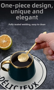 Detailed view of a gold-plated stainless steel spoon with plum blossom floral head design
