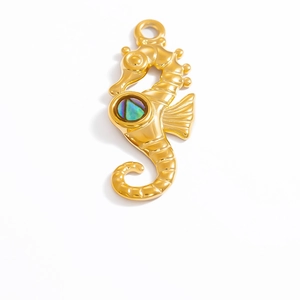 Detailed view of 18k gold plated stainless steel seahorse pendant with rainbow shell inlay