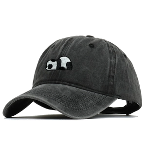 Close-up of premium panda embroidery on washed cotton distressed baseball cap fabric