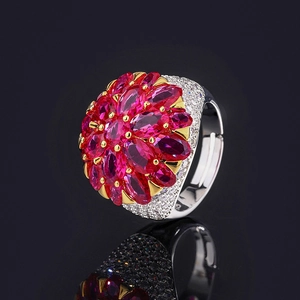 Vintage court style floral ring with pigeon blood red marquise cut stones and tiny diamonds