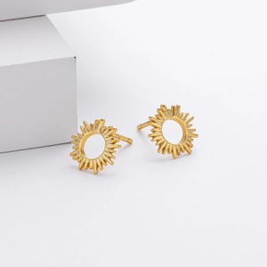 Macro detail of S925 sterling silver sunflower stud earrings with golden finish