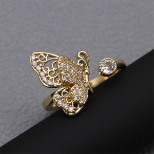 Macro detail of gold-plated butterfly ring with sparkling cubic zirconia pavé setting