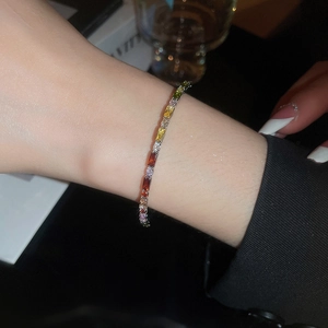 Close-up of rainbow zirconia bracelet with colorful stones on polished silver base