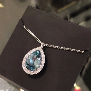 Blue teardrop crystal necklace with halo cubic zirconia setting on a fine silver chain