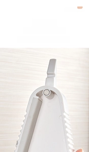 Macro view of magnetic suction design on white multifunctional jar opener for fridge storage