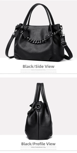 Detail view of black soft leather tote with bow decoration and dark metal chain strap