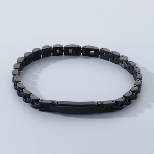 Macro shot of black stainless steel strap bracelet with smooth customizable metal plate