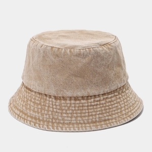 Detailed close-up of khaki washed cotton bucket hat with vintage textured stitching