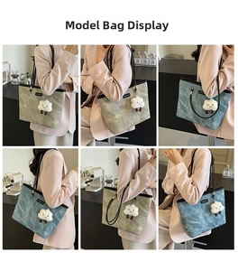 Detail of large tote bag showing washed marble texture and plush cloud charm accessory