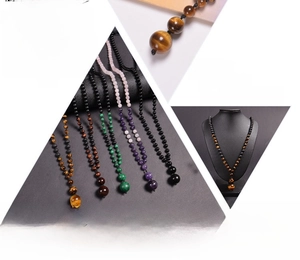 Detail of 16mm tiger eye pendant and natural lava stone beaded yoga necklace