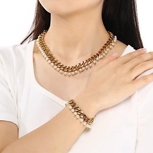 Elegantly styled 9mm gold Cuban chain necklace and bracelet set with white pearl accents