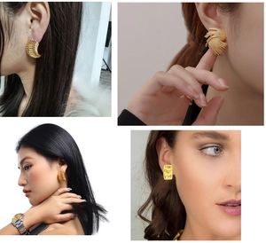 Detail of 18K gold plated stainless steel earrings with irregular textured designs
